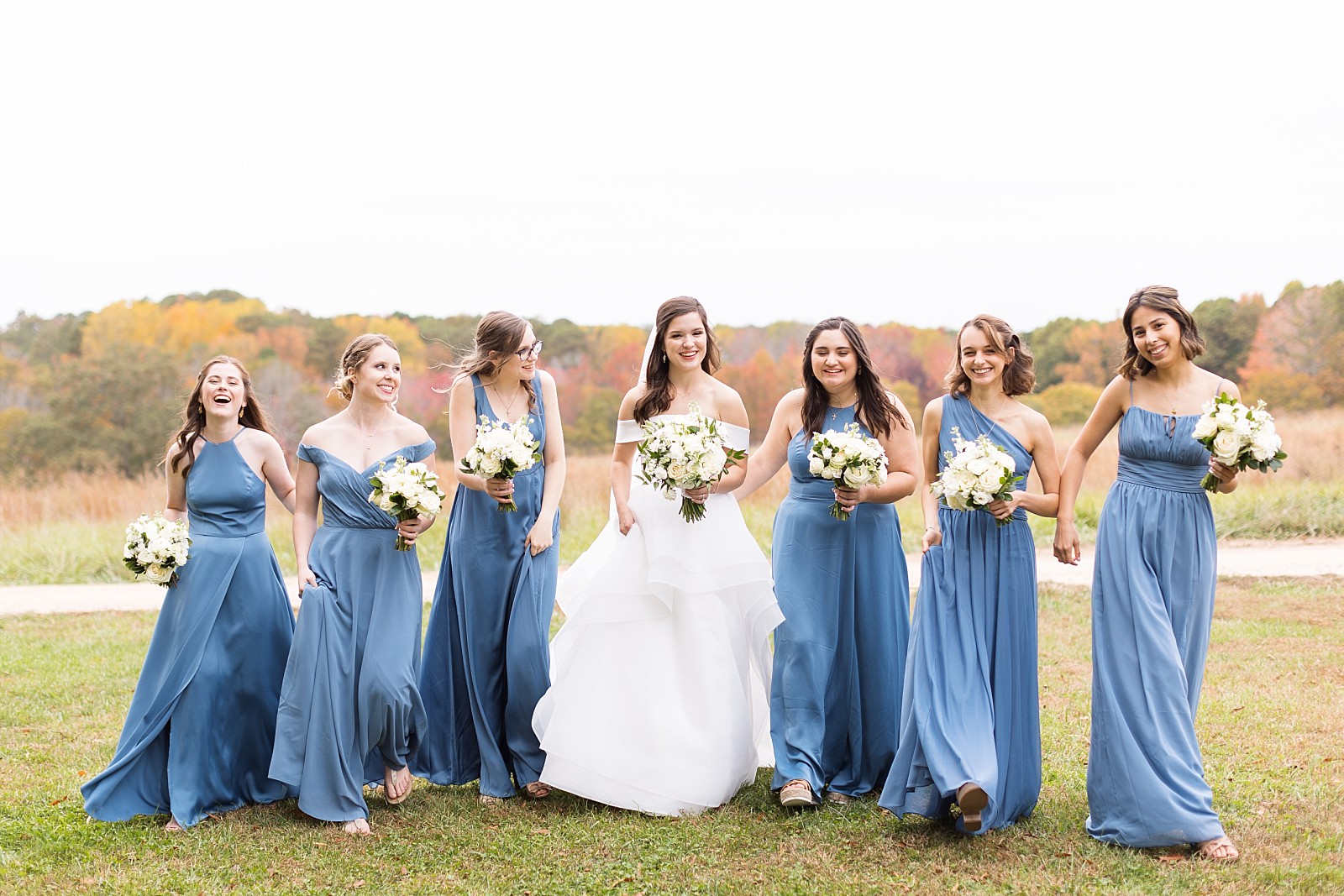 Bridesmaids walking   | Fall Wedding at The Meadows in Raleigh | Raleigh NC Wedding Photographer