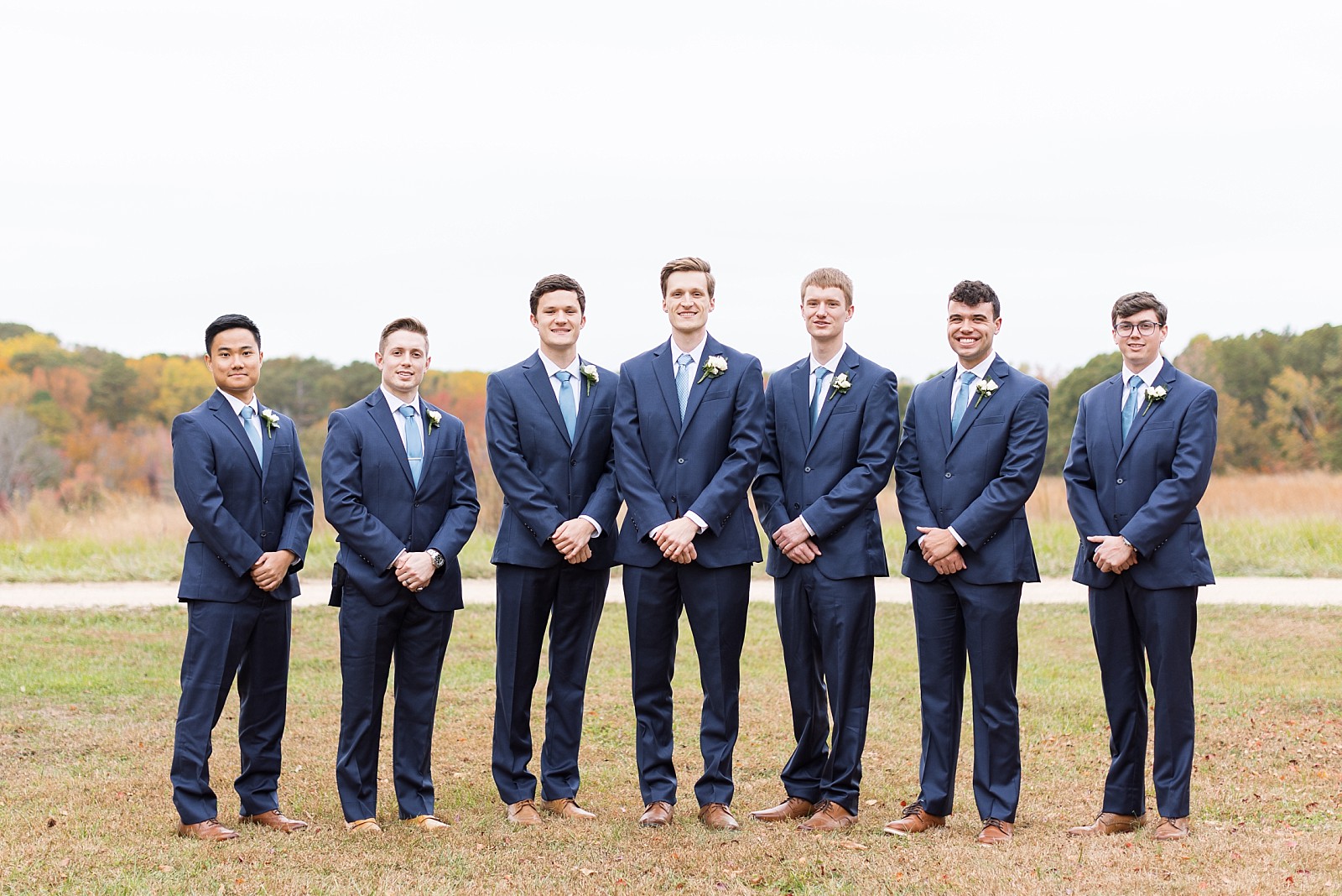 Groomsmen in navy suites  | Fall Wedding at The Meadows in Raleigh | Raleigh NC Wedding Photographer