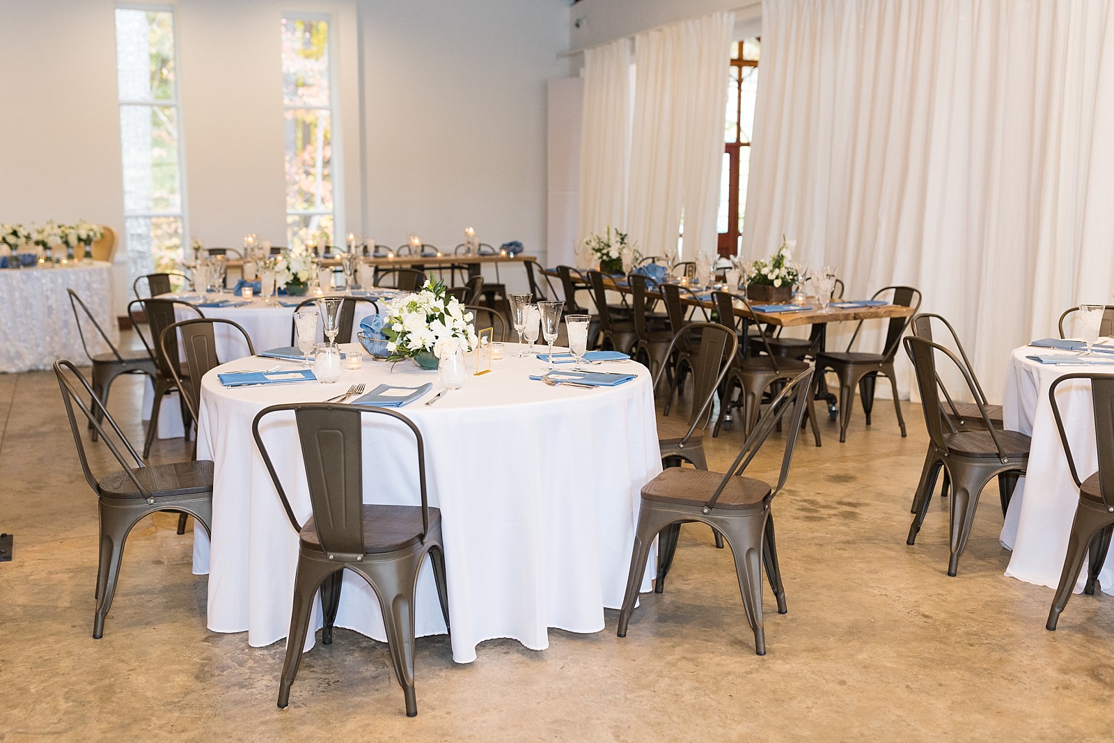 reception dining tables with metal chairs  | The Meadows in Raleigh | Raleigh NC Wedding Photographer