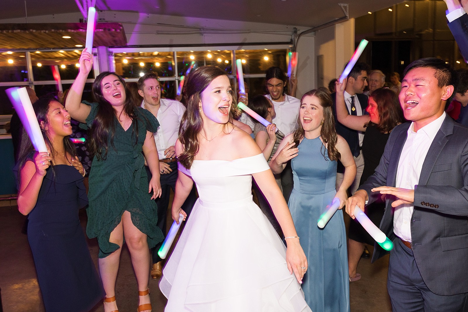 bride dancing with glow sticks  | The Meadows in Raleigh | Raleigh NC Wedding Photographer