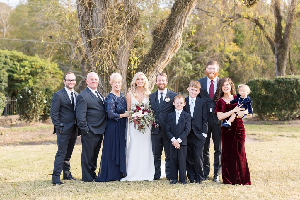 bride and groom with bride's family | Fall wedding at Walnut Hill in Raleigh NC | Raleigh NC wedding photographer 
