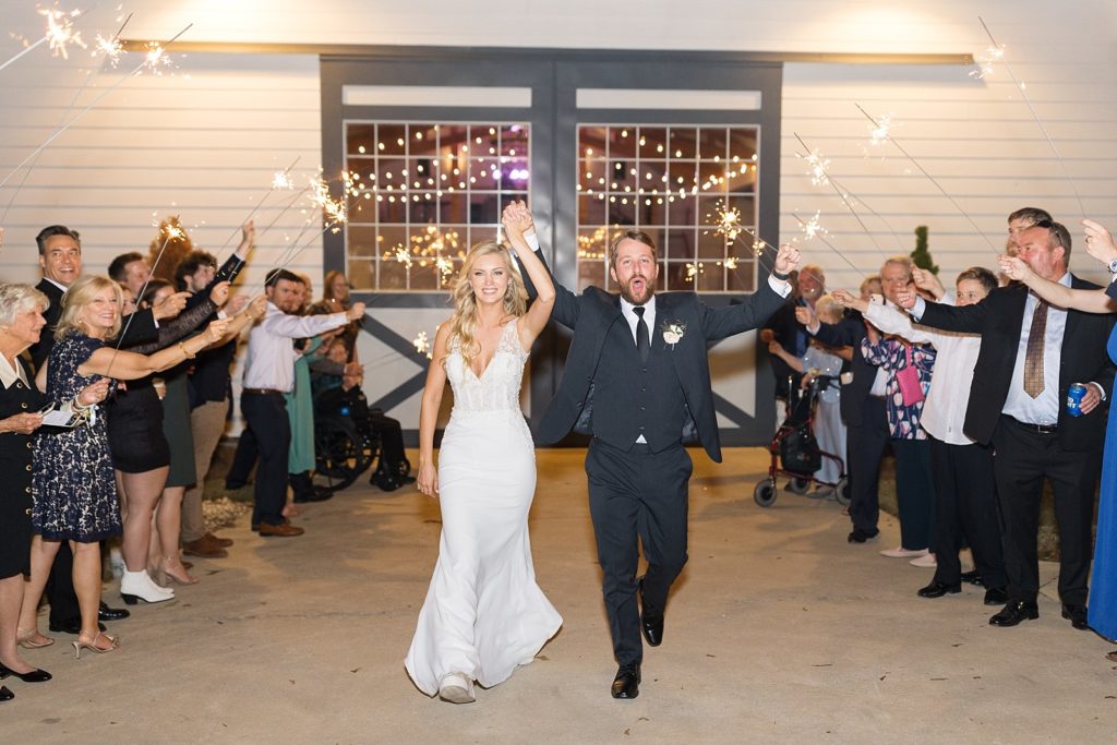 bride and groom during their sparkler exit | Fall wedding at Walnut Hill in Raleigh NC | Raleigh NC wedding photographer 