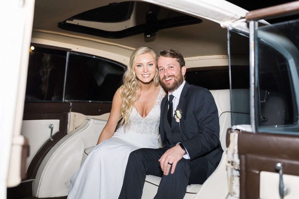 bride and groom in  Rolls Royce getaway car| Fall wedding at Walnut Hill in Raleigh NC | Raleigh NC wedding photographer 