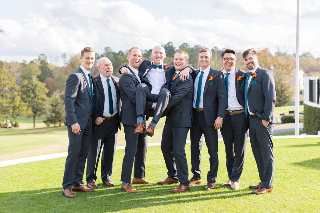 Groomsmen picking up groom | Fall wedding at Hope Valley Country Club | Durham Wedding | Raleigh NC wedding photographer 