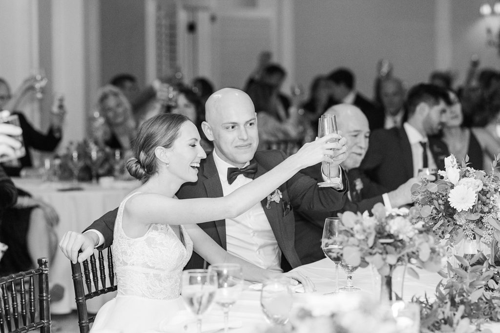 bride and groom cheersing  | Fall wedding at Hope Valley Country Club | Durham Wedding | Raleigh NC wedding photographer 