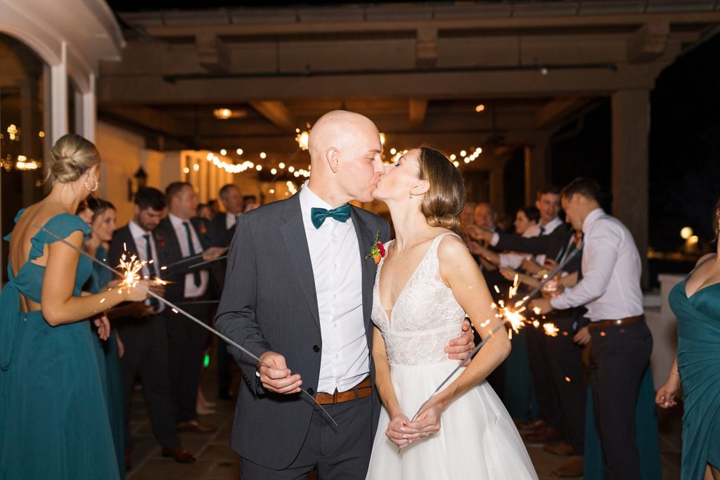 bride and groom kissing during sparkler exit  | Fall wedding at Hope Valley Country Club | Durham Wedding | Raleigh NC wedding photographer 