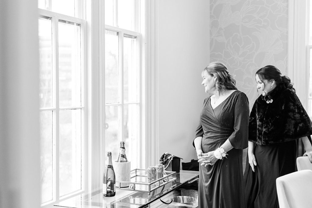 Bride and groom's mothers watching everyone arrive | Classic Black and white wedding at Merrimon-Wynne | Raleigh NC Wedding Photographer 