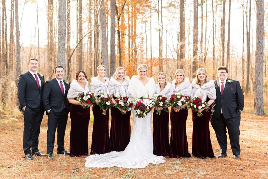 Bride and bridesmaids in fur cover up for winter wedding | Christmas Wedding at Pinehill Pavilion | Raleigh NC Wedding Photographer 