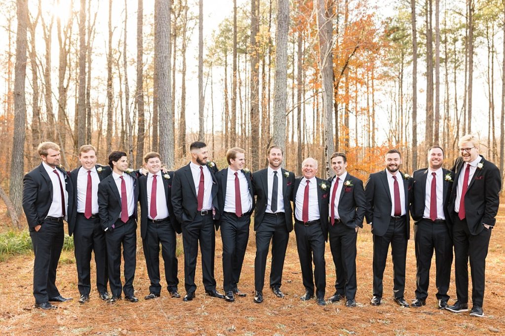 Groomsmen in red ties and black suits | Christmas Wedding at Pinehill Pavilion | Raleigh NC Wedding Photographer 