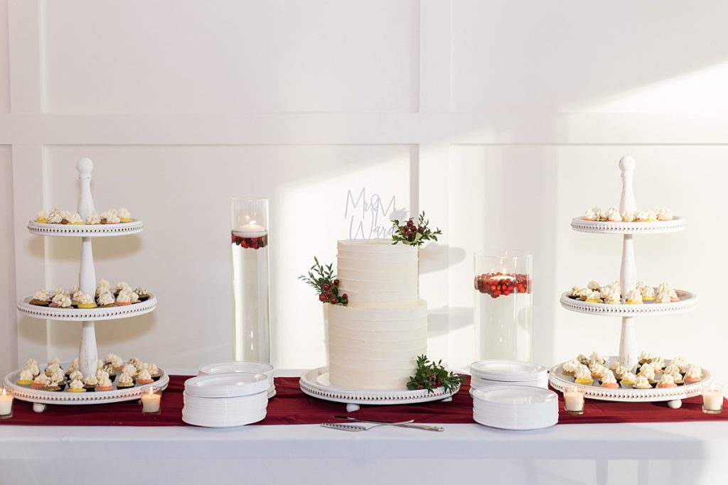 Dessert table with wedding cake and mini cupcakes | Christmas Wedding at Pinehill Pavilion | Raleigh NC Wedding Photographer 