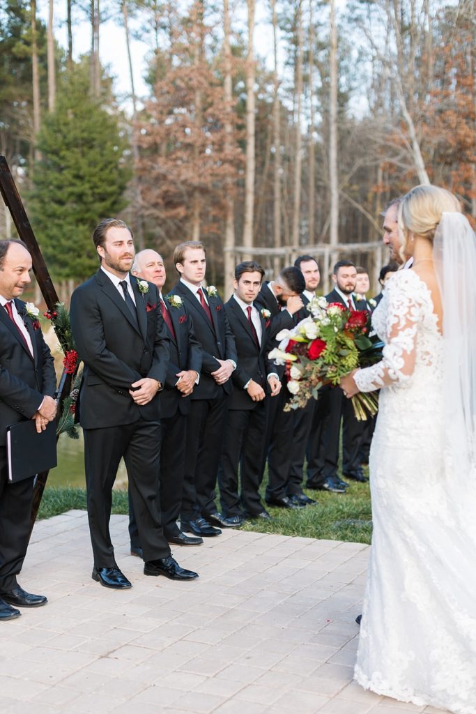 Bride approaching her groom at the alter | Christmas Wedding at Pinehill Pavilion | Raleigh NC Wedding Photographer 