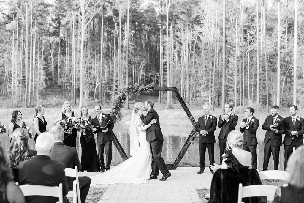 Bride and grooms first kis | Christmas Wedding at Pinehill Pavilion | Raleigh NC Wedding Photographer 