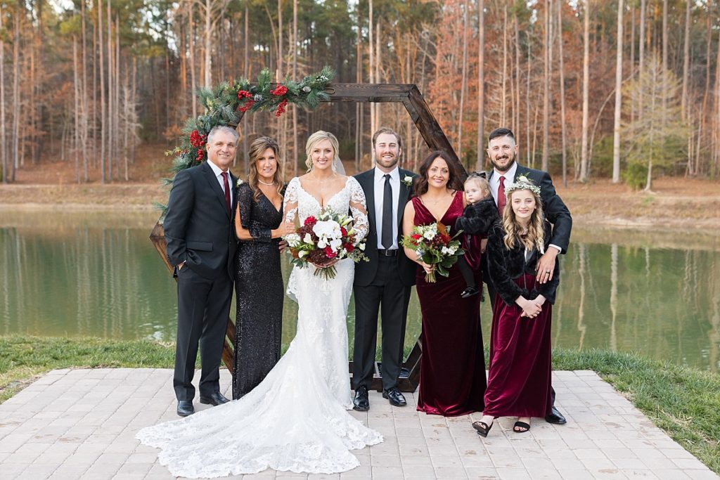 Bride and groom with bride's family | Christmas Wedding at Pinehill Pavilion | Raleigh NC Wedding Photographer 