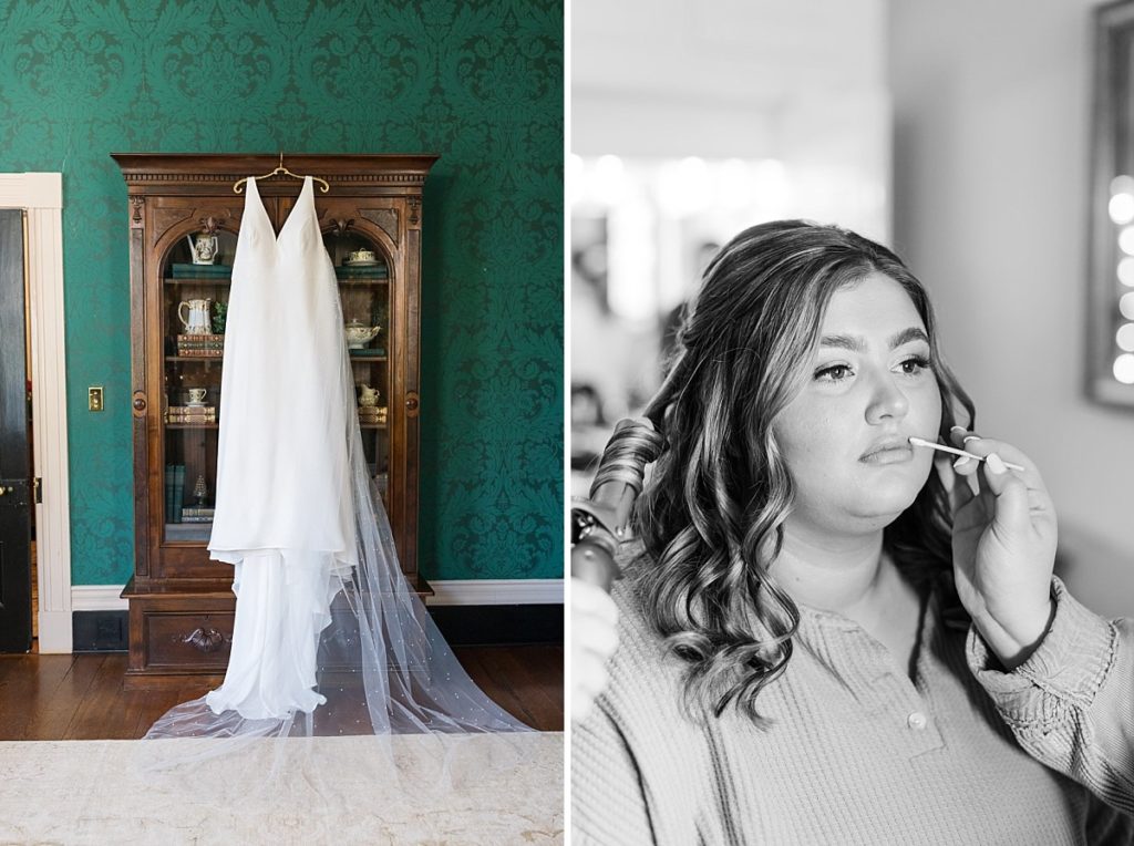 Wedding dress hanging on antique furniture with emerald wallpaper and bride getting her hair and makeup done | Emerald Christmas Wedding at The Sutherland Estate | Raleigh NC Wedding Photographer