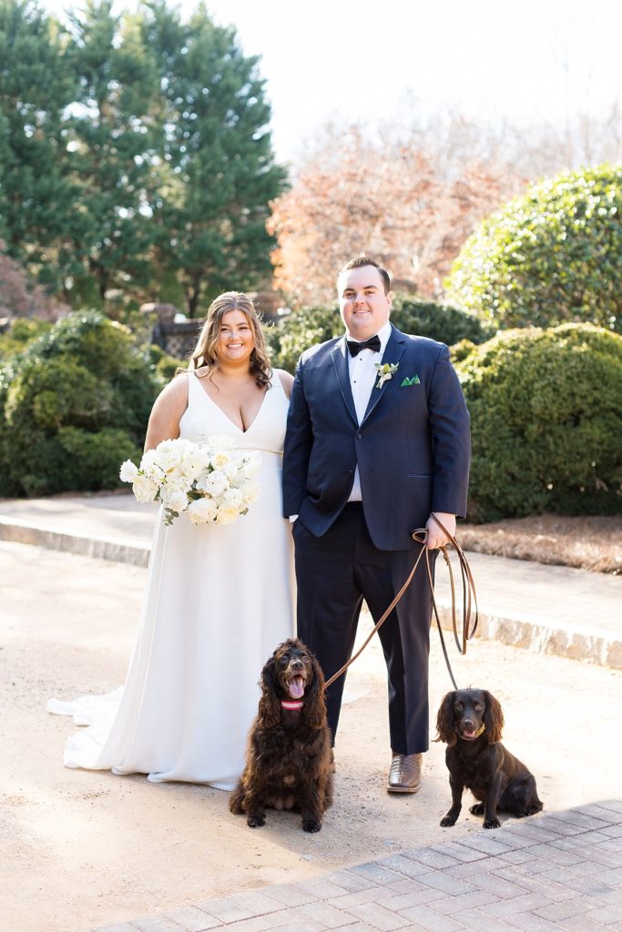 Bride and groom with their two dogs at their wedding | Emerald Christmas Wedding at The Sutherland Estate | Raleigh NC Wedding Photographer