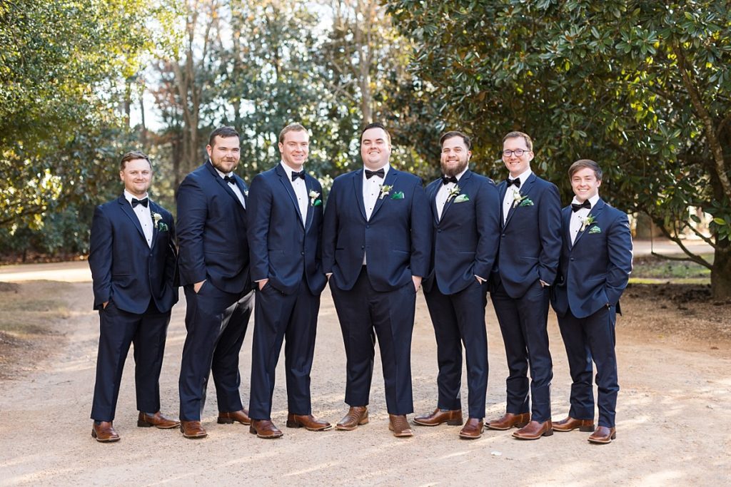 Groomsmen in navy with emerald handkerchief | Emerald Christmas Wedding at The Sutherland Estate | Raleigh NC Wedding Photographer