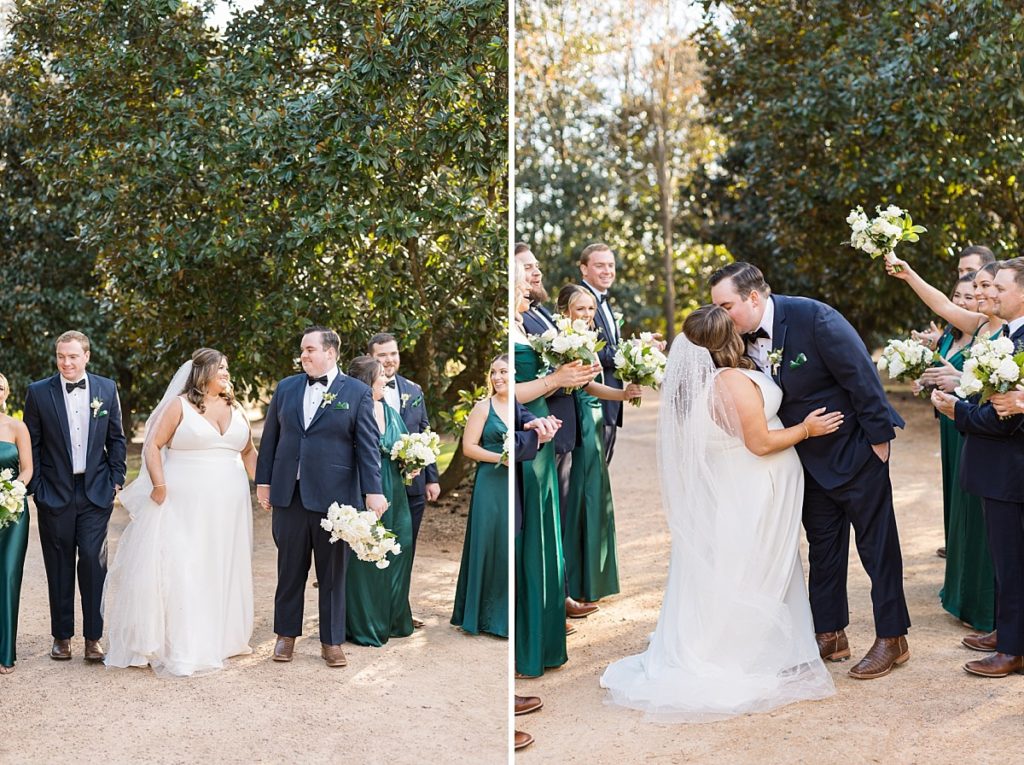 Bride and groom kissing while wedding party celebrates Emerald Christmas Wedding at The Sutherland Estate | Raleigh NC Wedding Photographer