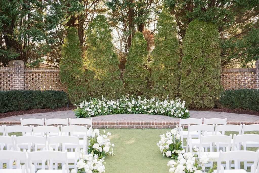Elegant white wedding flowers for ceremony | Emerald Christmas Wedding at The Sutherland Estate | Raleigh NC Wedding Photographer