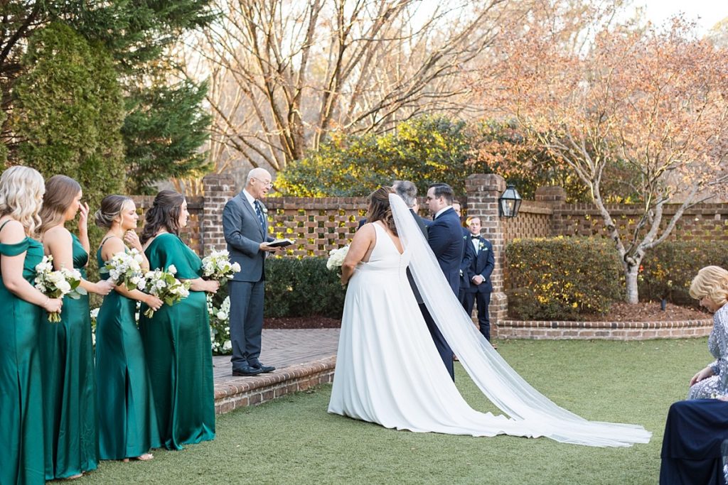 Bride and groom at the alter | Emerald Christmas Wedding at The Sutherland Estate | Raleigh NC Wedding Photographer