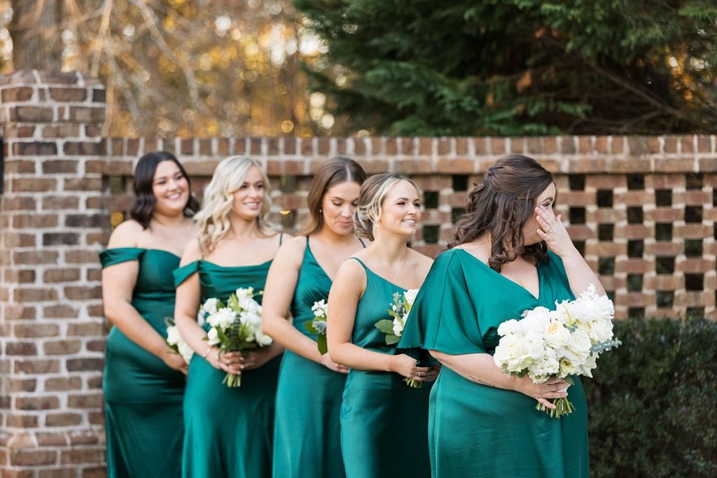 Bridesmaids during ceremony | Emerald Christmas Wedding at The Sutherland Estate | Raleigh NC Wedding Photographer
