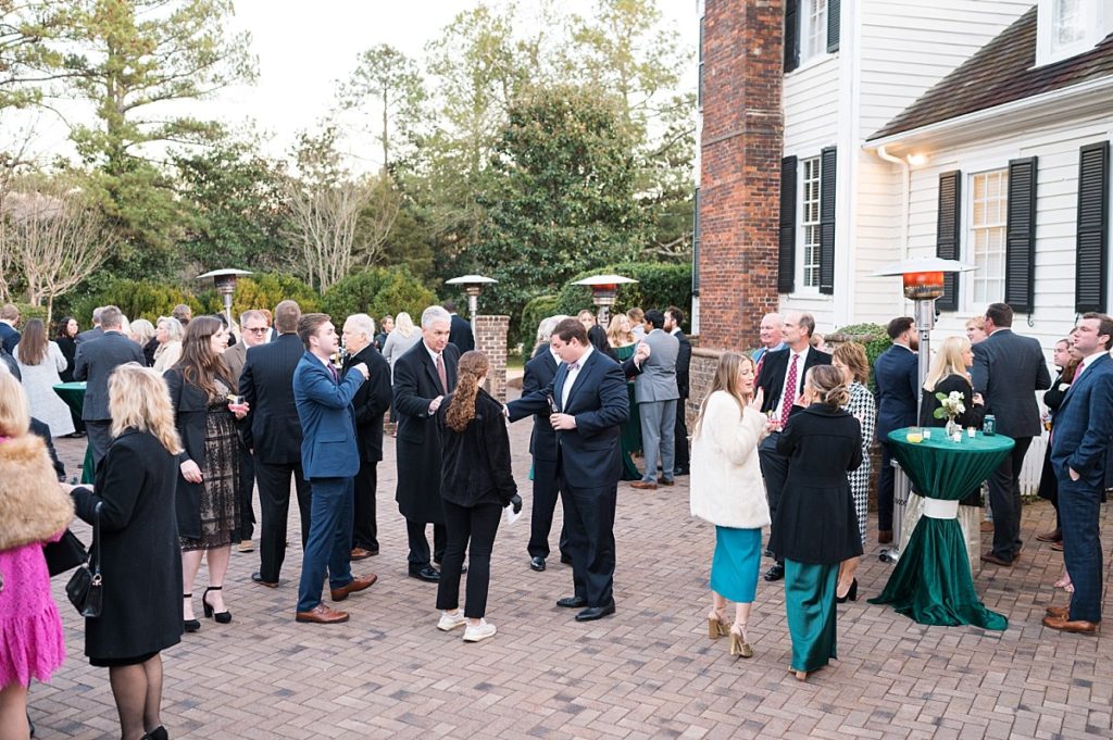 guests enjoying outdoor cocktail party | Emerald Christmas Wedding at The Sutherland Estate | Raleigh NC Wedding Photographer