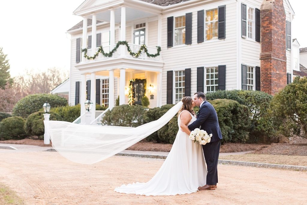Bride and groom outside wedding venue| Emerald Christmas Wedding at The Sutherland Estate | Raleigh NC Wedding Photographer