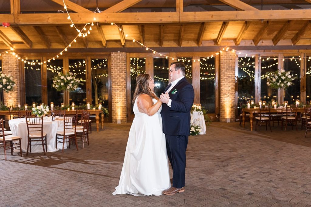 Bride and groom sharing their last dance  | Emerald Christmas Wedding at The Sutherland Estate | Raleigh NC Wedding Photographe