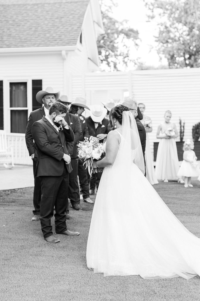 Groomsman wearing cowboy hats | Raleigh wedding photographer