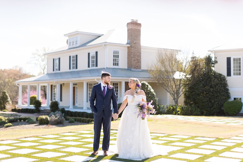 Bride and groom on checkered lawn | Spring Wedding at Walnut Hill | Raleigh NC Wedding Photographer