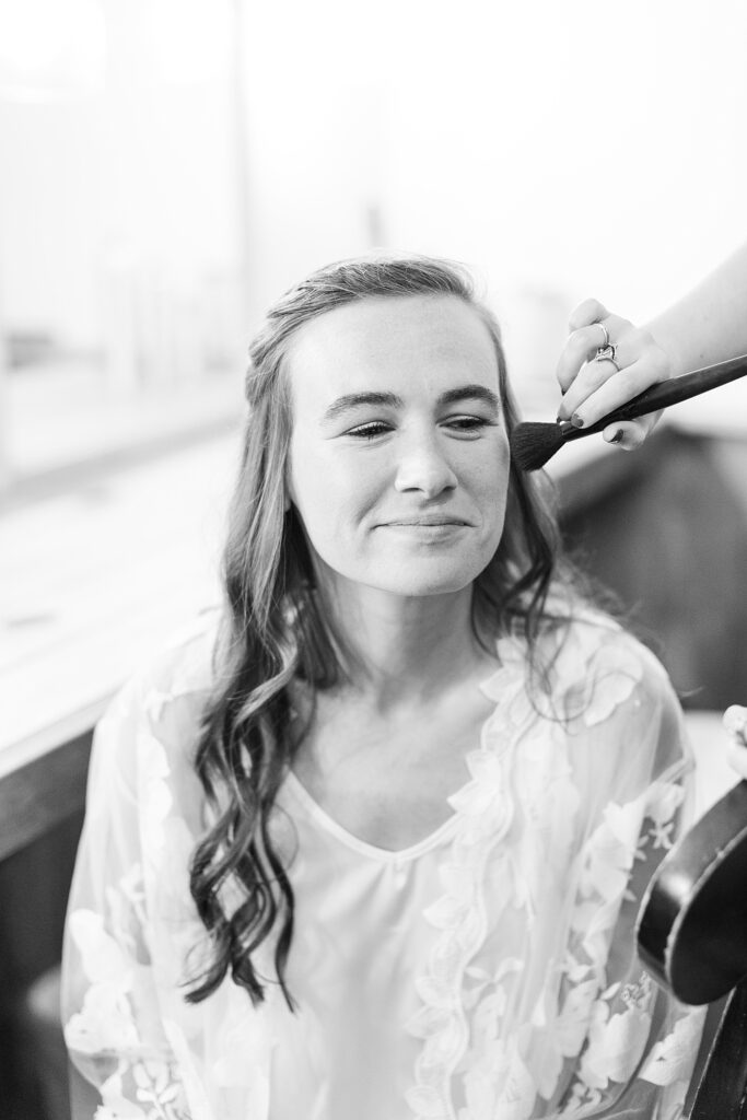 Bride getting her makeup done | Amazing Graze Barn Wedding | Amazing Graze Barn Wedding Photographer