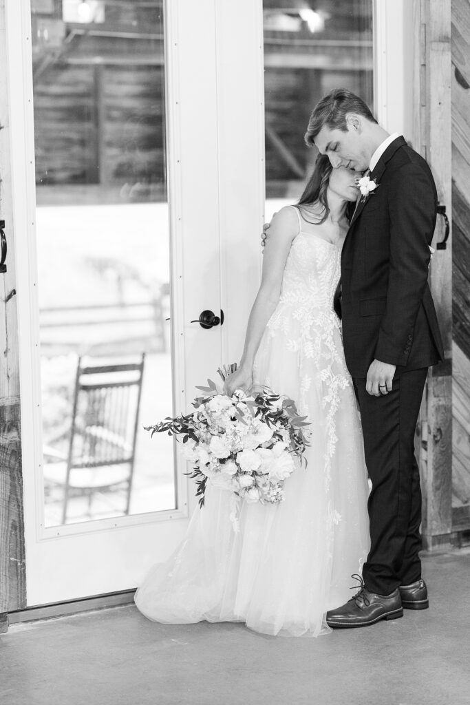 Bride and groom embracing | Amazing Graze Barn Wedding | Amazing Graze Barn Wedding Photographer