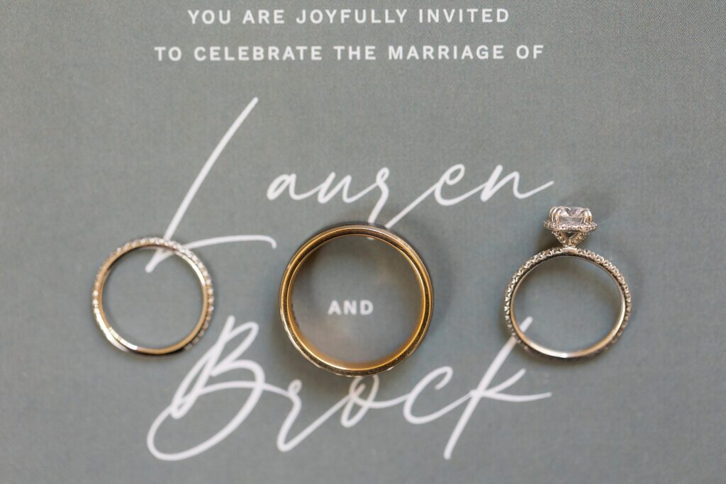 Wedding rings displayed on wedding invitation | The Bradford Wedding | The Bradford Wedding Photographer 