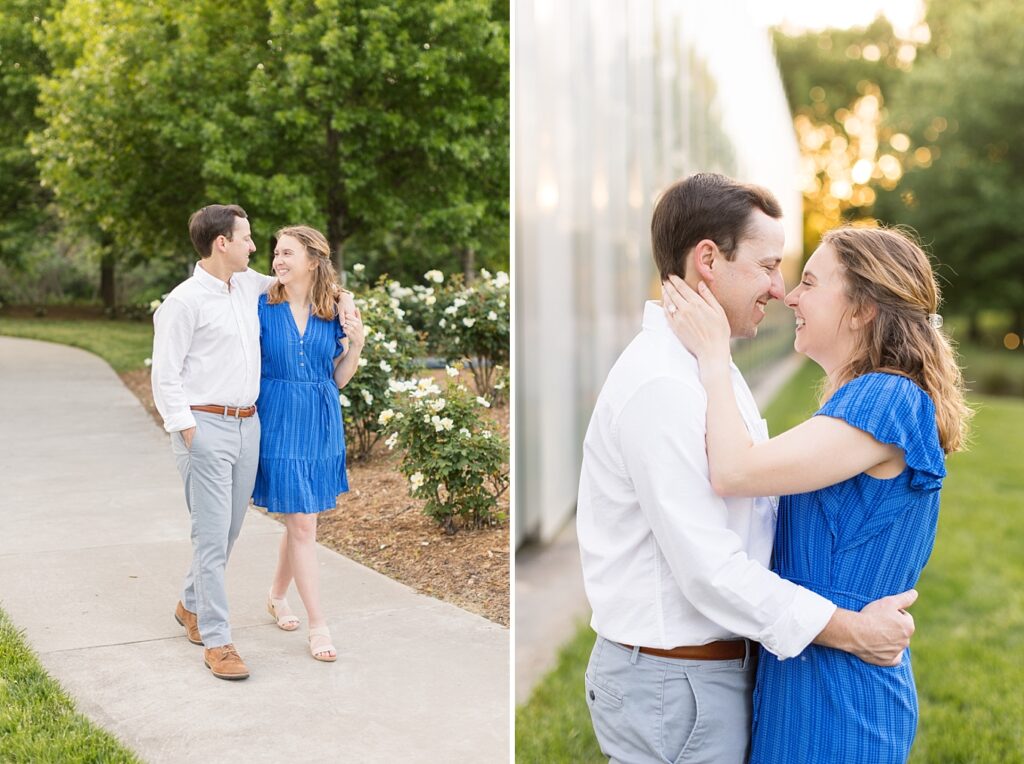Couple walking by white flowers and posing nose to nose | Spring engagement photos | Raleigh NC Engagement Photographer | Raleigh NC Museum of Art Engagement Session