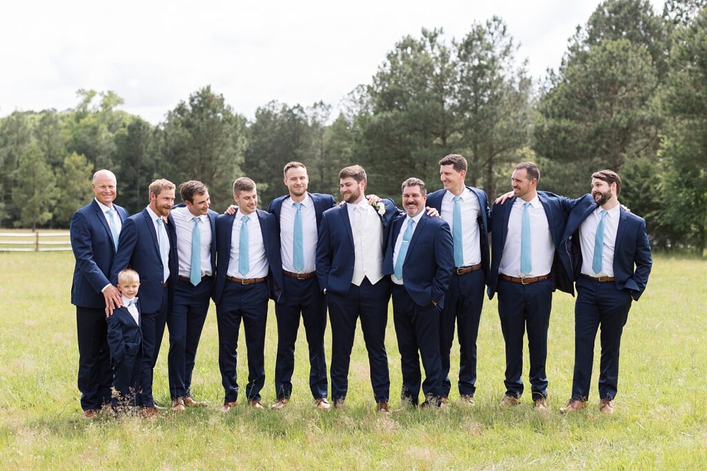 Groom posing with groomsmen | Groomsmen outfit inspiration | The Evermore Wedding | The Evermore Wedding Photographer | Raleigh NC Wedding Photographer