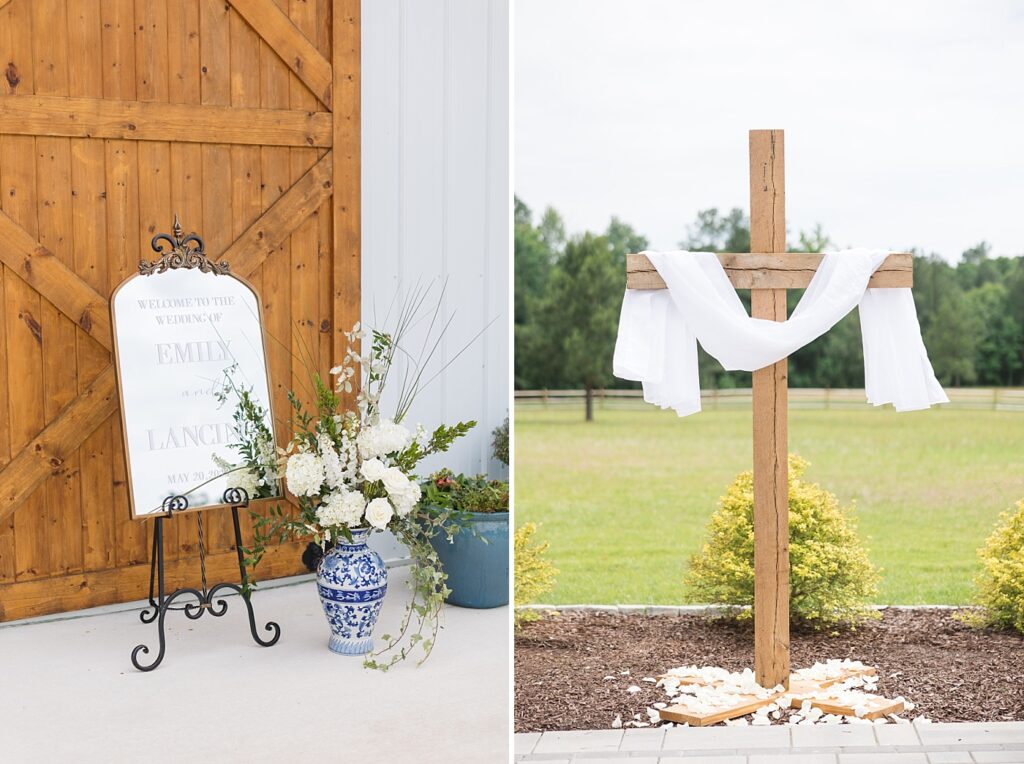 Welcome to wedding sign with ginger jar holding white flowers and cross with white petals on floor | The Evermore Wedding | The Evermore Wedding Photographer | Raleigh NC Wedding Photographer