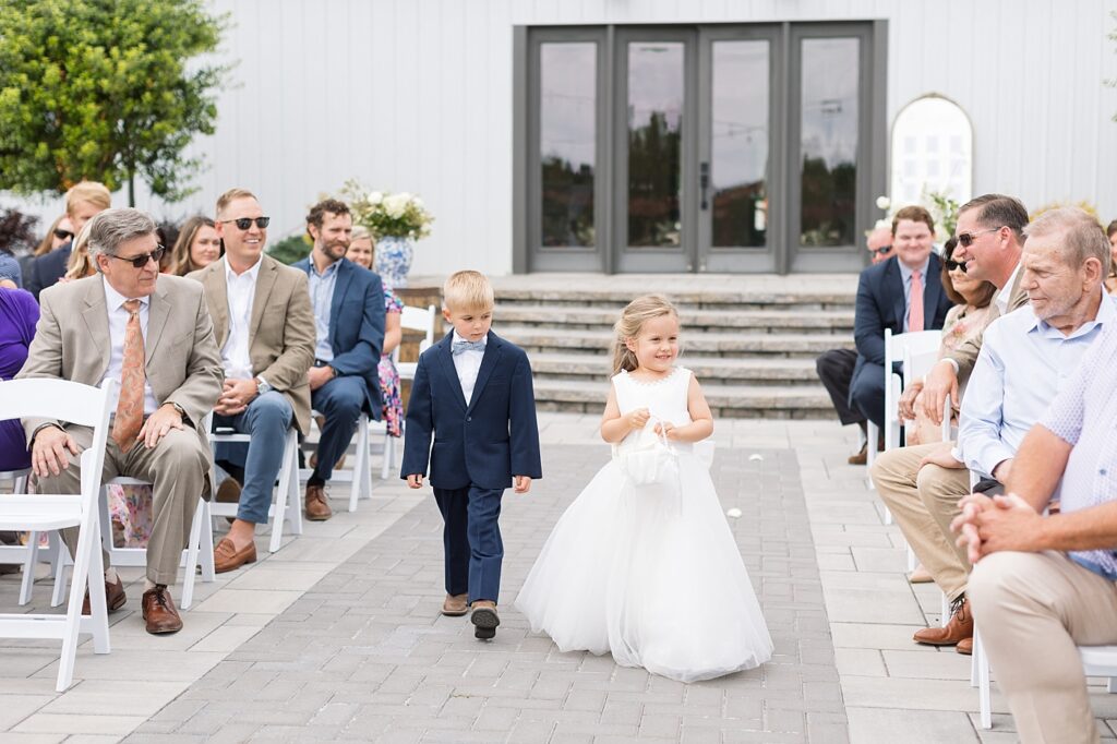 Flower girl walking down aisle | The Evermore Wedding | The Evermore Wedding Photographer | Raleigh NC Wedding Photographer