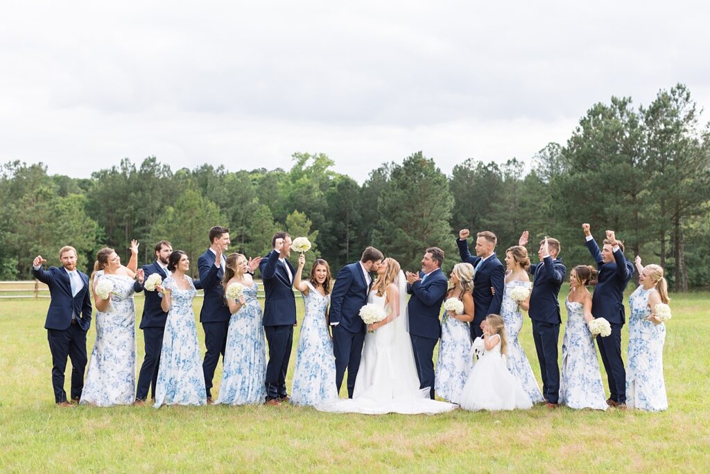Wedding party cheering bride and groom | The Evermore Wedding | The Evermore Wedding Photographer | Raleigh NC Wedding Photographer