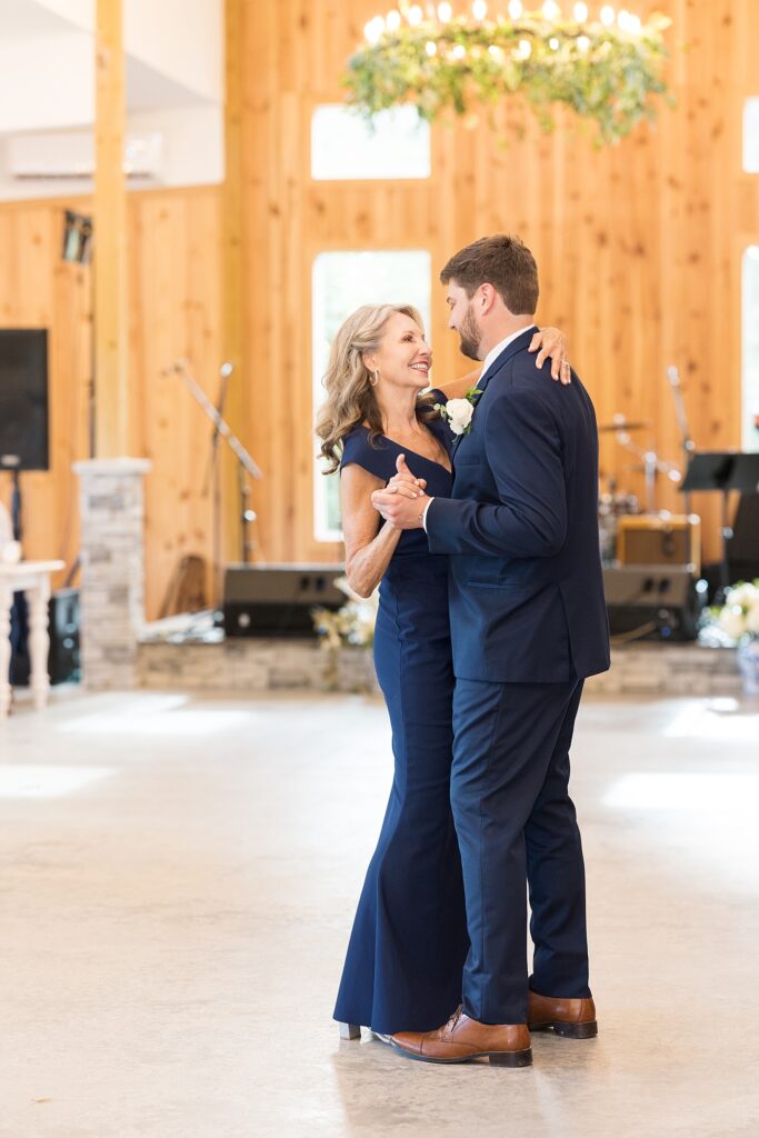 Closeup of groom dancing with his mom | The Evermore Wedding | The Evermore Wedding Photographer | Raleigh NC Wedding Photographer