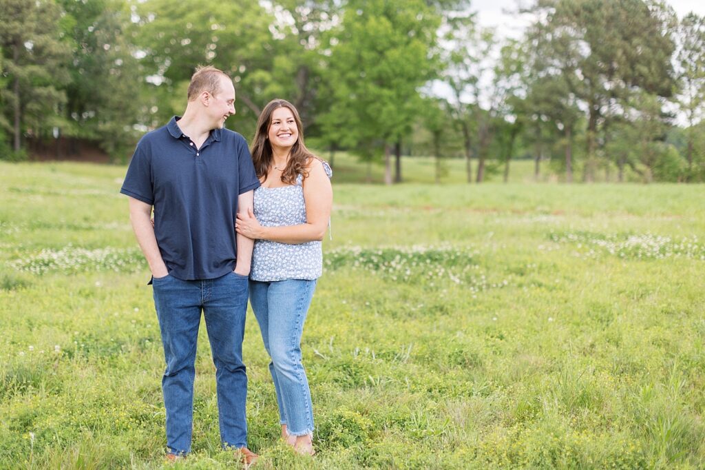 Engagement photos in lush green field | Raleigh NC Engagement Photographer | Sarah Hinckley Wedding Photographer