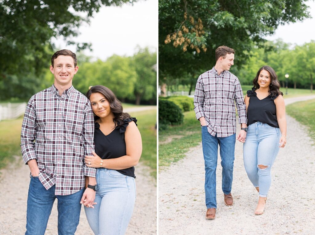 Couple holding hands on dirt path by tall trees | Raleigh NC Engagement Photographer | Historic Oak View Engagement Session