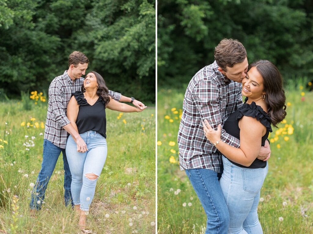 Couple kissing in open field with yellow and white flowers | Raleigh NC Engagement Photographer | Historic Oak View Engagement Session