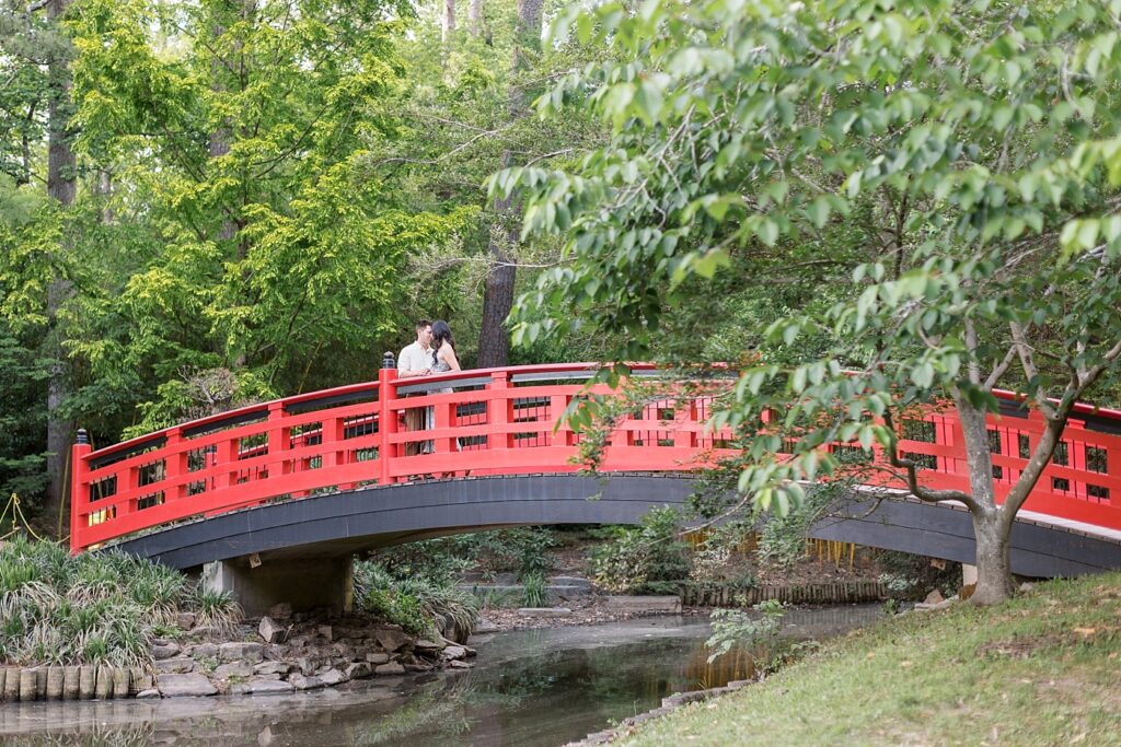 Engagement photos on bridge | Duke Gardens engagement photos | Raleigh NC wedding photographer 