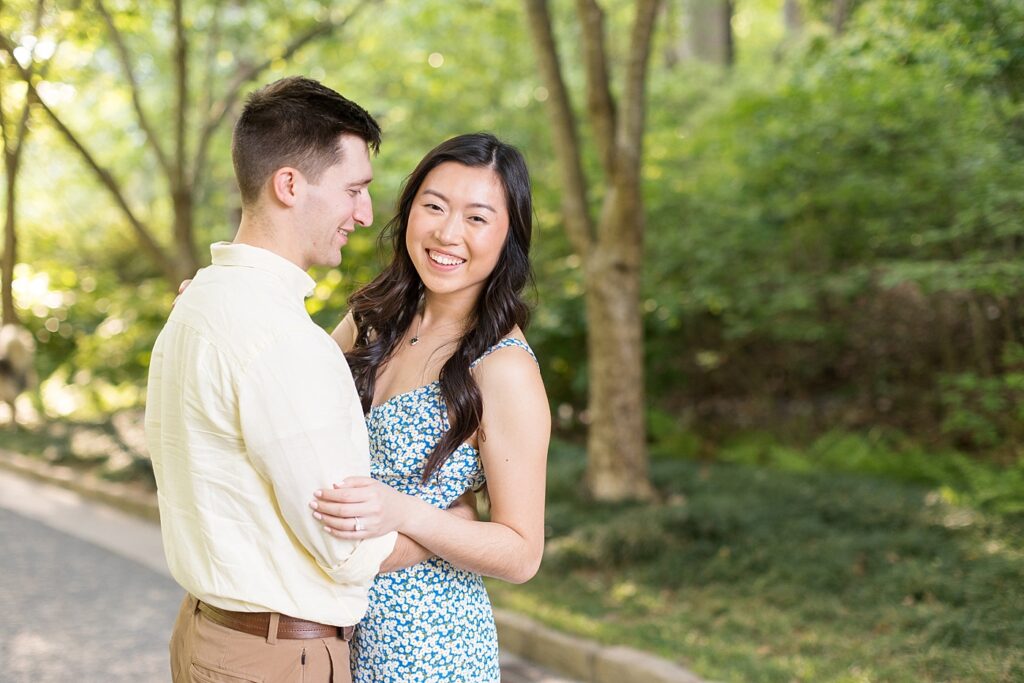 Couple embracing in garden | Duke Gardens engagement photos | Raleigh NC wedding photographer 