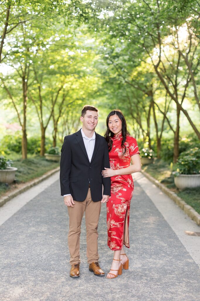 Chinese American Engagement outfit inspiration red dress and black jacket with dark khaki pants | Duke Gardens engagement photos | Raleigh NC wedding photographer 