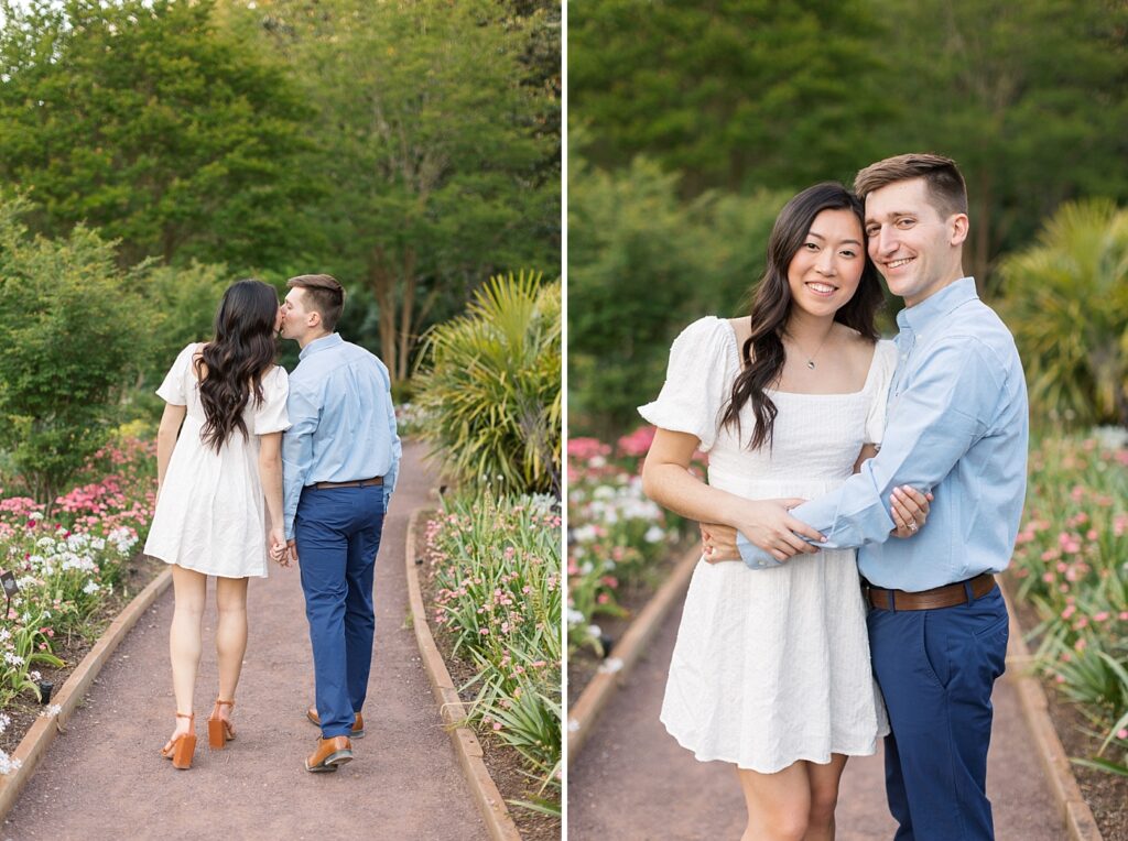Couple kissing and walking away near garden | Duke Gardens engagement photos | Raleigh NC wedding photographer 
