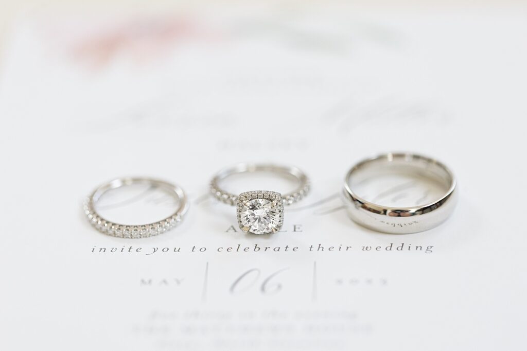 Wedding rings displayed on top of wedding invitation | Spring Wedding | The Matthews House Wedding | The Matthews House Wedding Photographer | Raleigh NC Wedding Photographer