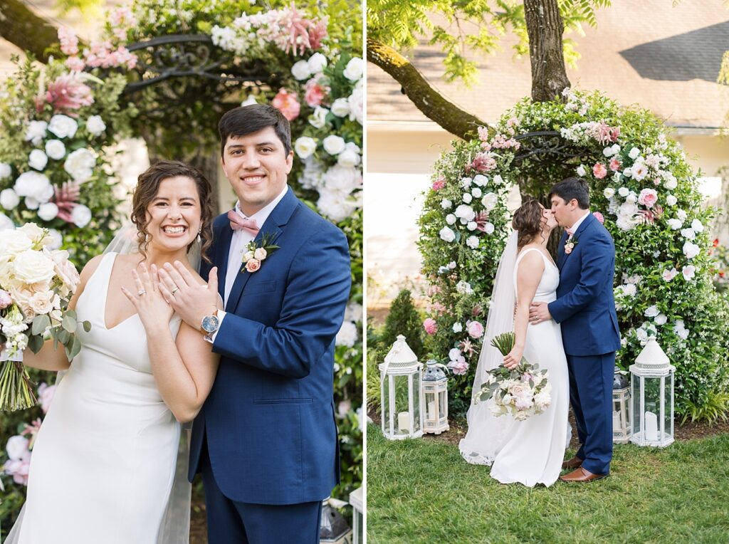 Bride and groom showing wedding bands in front of white and pink roses | Spring Wedding | The Matthews House Wedding | The Matthews House Wedding Photographer | Raleigh NC Wedding Photographer