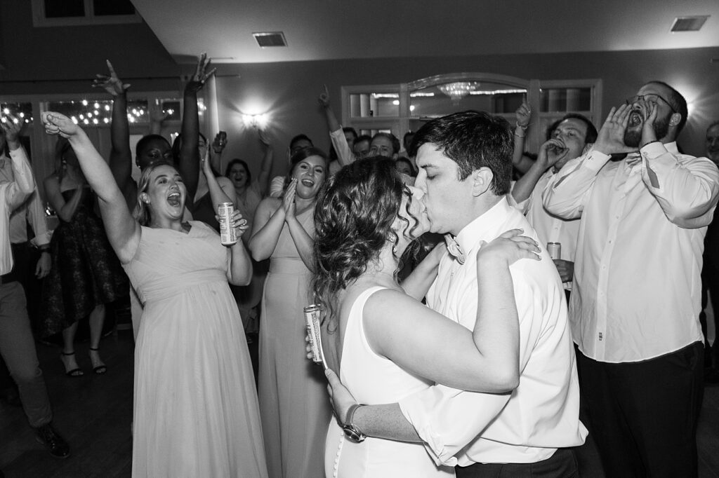 Bride and groom kissing during wedding reception | Spring Wedding | The Matthews House Wedding | The Matthews House Wedding Photographer | Raleigh NC Wedding Photographer