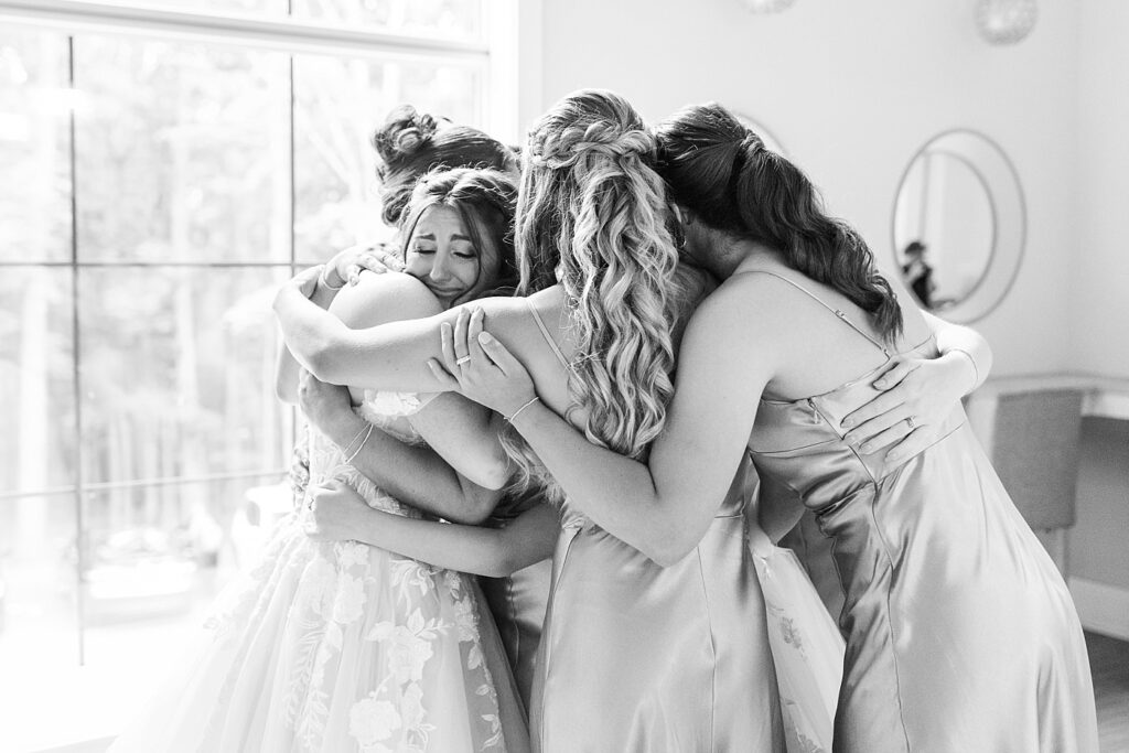 Bride and bridesmaids hugging | Blue and white Wedding | Carolina Groves Wedding | Carolina Groves Wedding Photographer | Raleigh NC Wedding Photographer