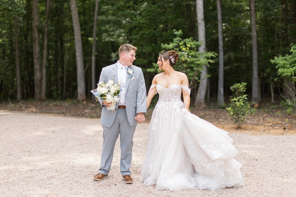 Bride and groom holding hands | Blue and white Wedding | Carolina Groves Wedding | Carolina Groves Wedding Photographer | Raleigh NC Wedding Photographer